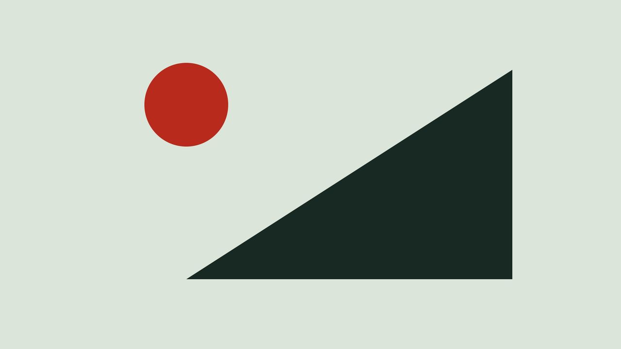 A dark triangle and a red circle on a pale green field